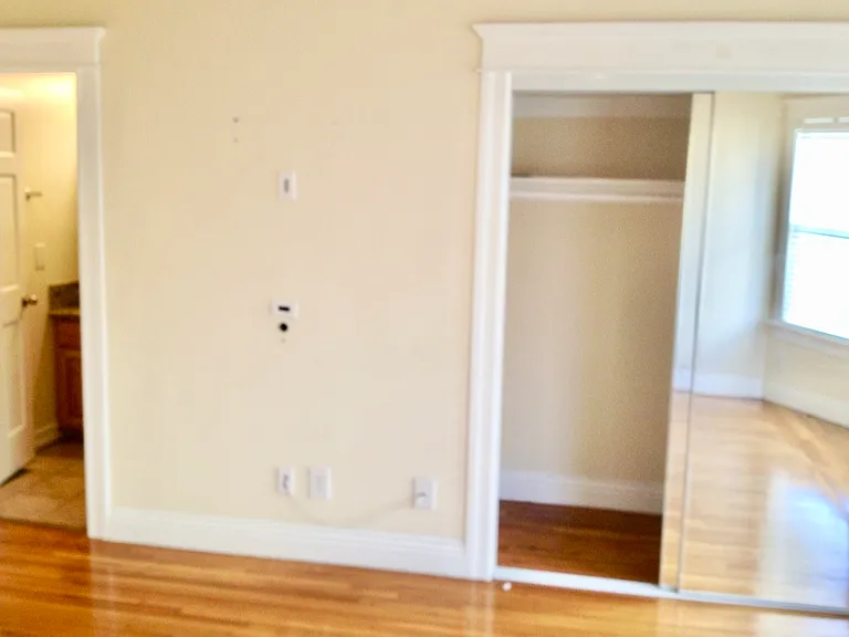 Spacious private bedroom in USC student housing with hardwood floors and natural light - ideal for graduates