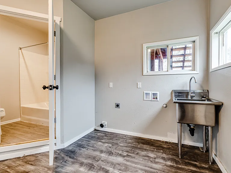 The 34d bedroom/flex/bonus room currently is equipped with a front loading washer and dryer.