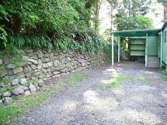rock wall and carport
