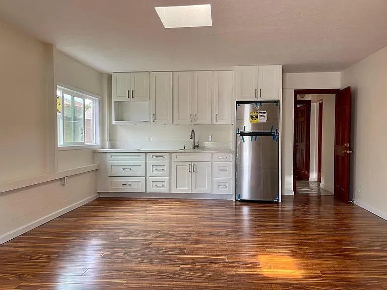 Large living / kitchen area with new kitchenette