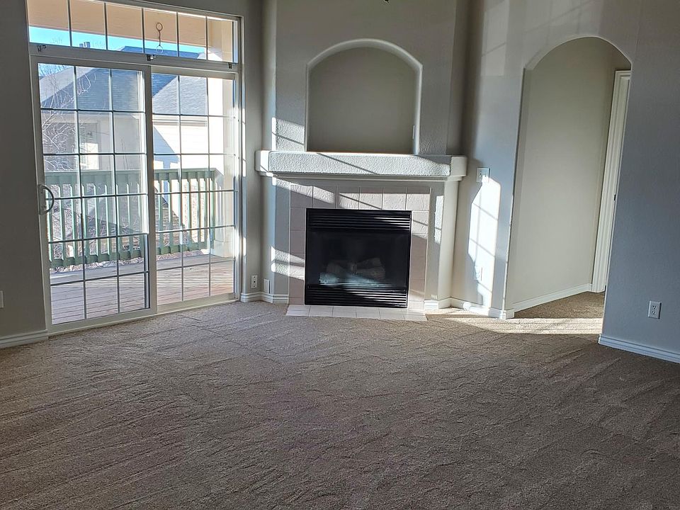 Living Room with Gas Fireplace and balcony access.