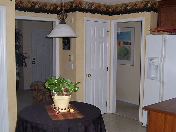 kitchen showing pantry & refrigerator