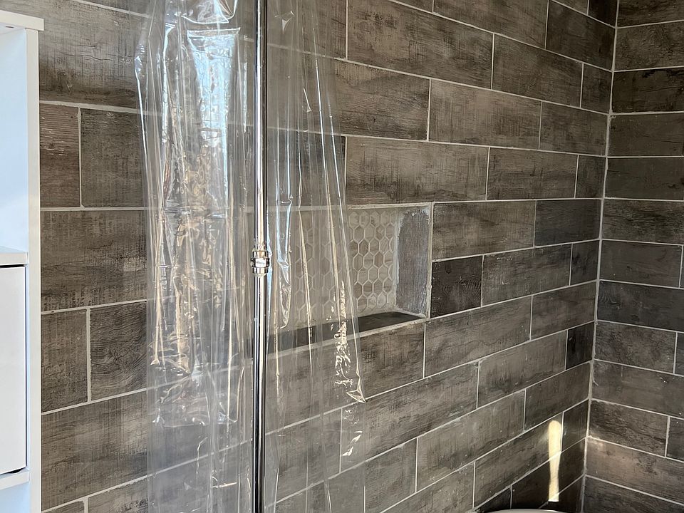 bathroom with large tub