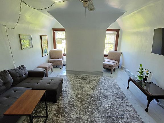 The living room comes with the furniture seen here, including the smart TV. The couch has storage and folds out into a queen size bed for guests.