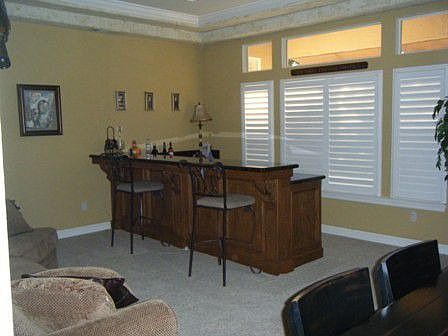 10 foot custom bar with 2 wine cellers and a refrigerator