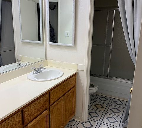 Bathroom entry and toilet/ shower, tub. in view