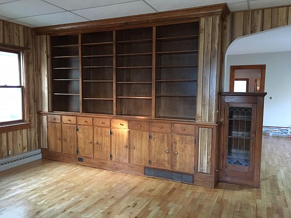 Built ins in living room with hardwood floors