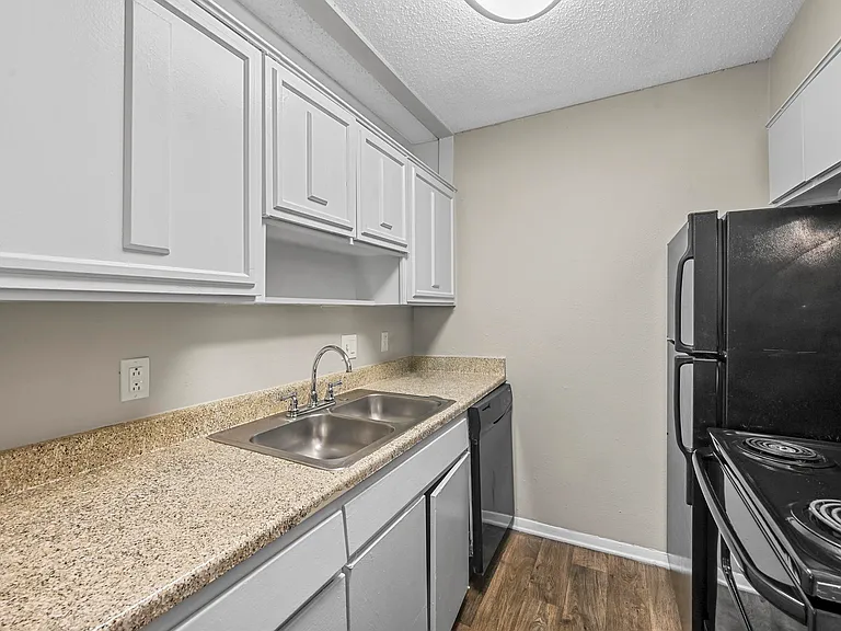 Whole lots of cabinets in kitchen area for pots and pans.