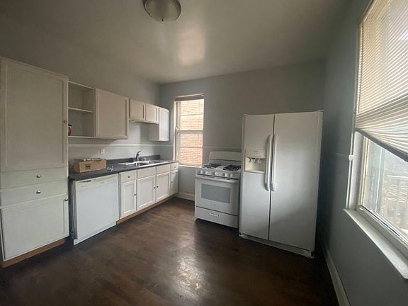 Kitchen is not fancy but is flexible and has all the essentials, including gas range, dishwasher, and garbage disposal