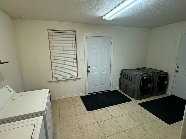 Laundry/mud room. Door to back yard and garage.
