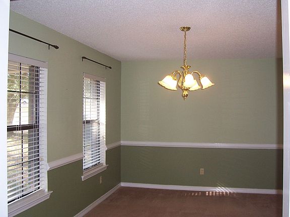 Formal dining room with a closet for storage.