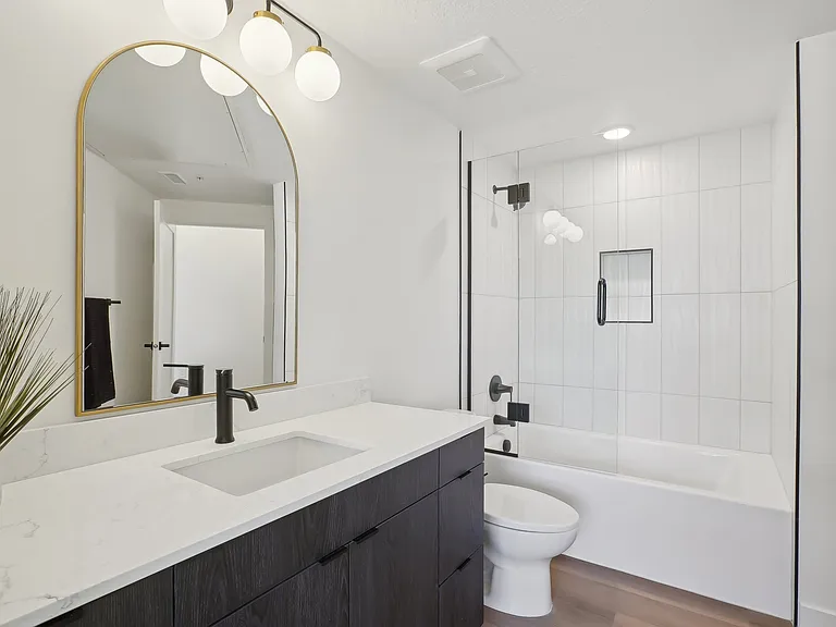 Liberty Duet Apartments, Salt Lake City, Utah; A bathroom with a white sink and a white toilet.
