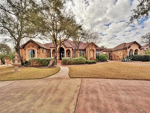 stunning curb appeal, stained concrete circular driveway