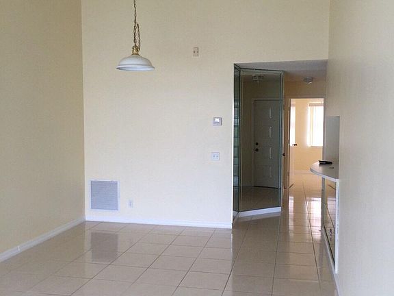 Spacious living area with tile floors