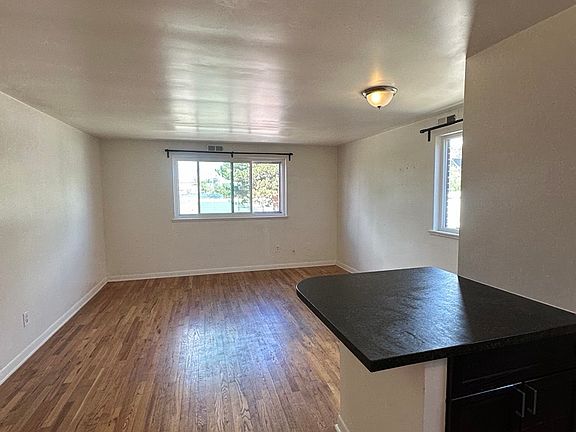 living room and kitchen peninsula