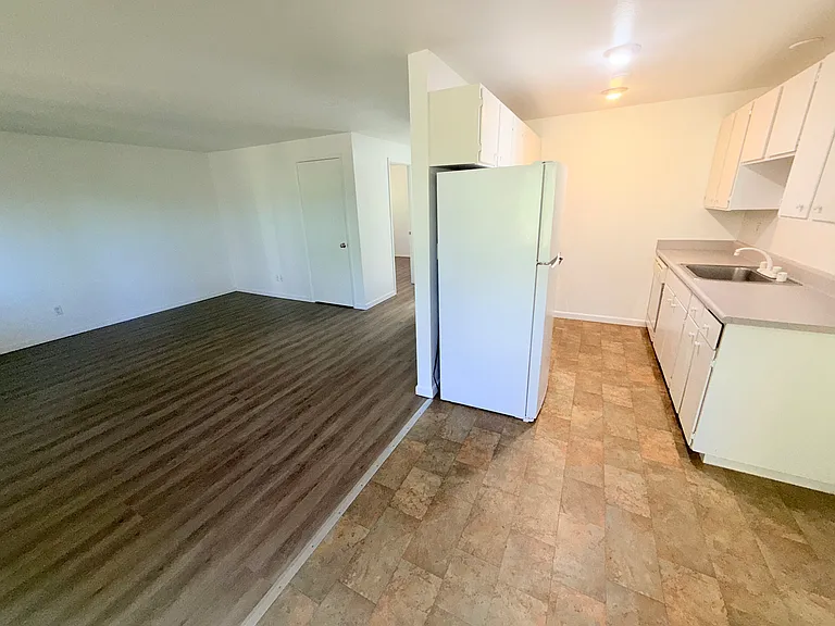 Nice size kitchen with dining area and view of large living room area