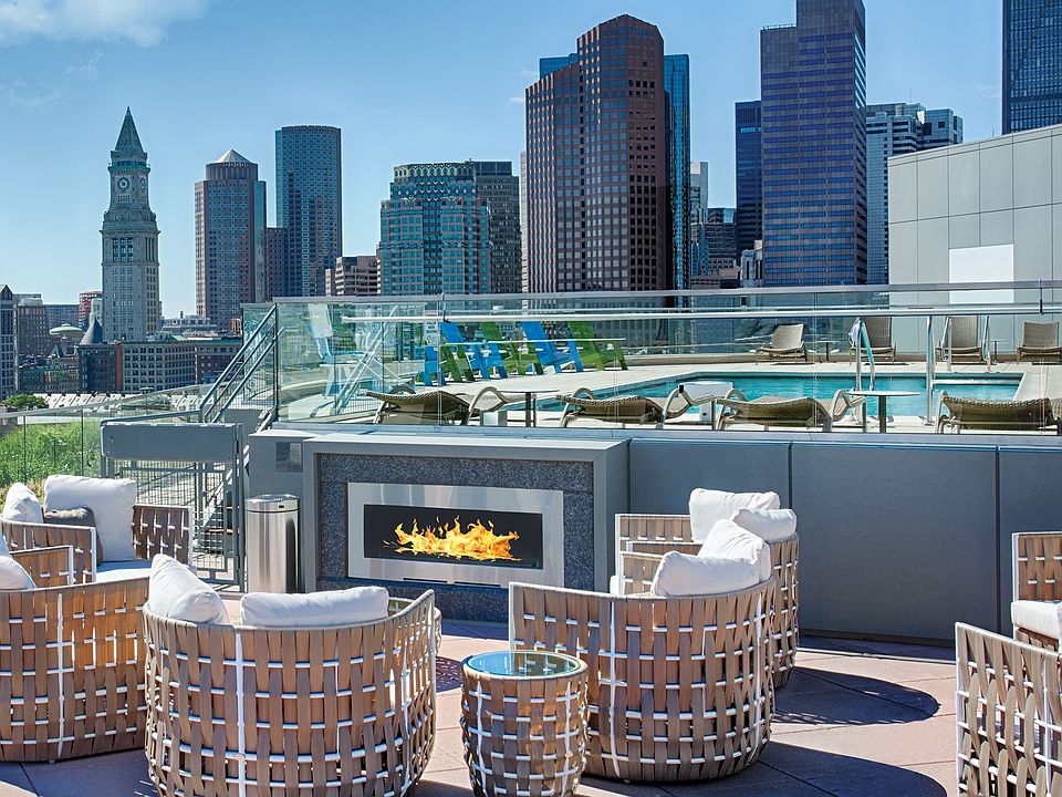 Warm up on breezy nights at the poolside fireplace lounge