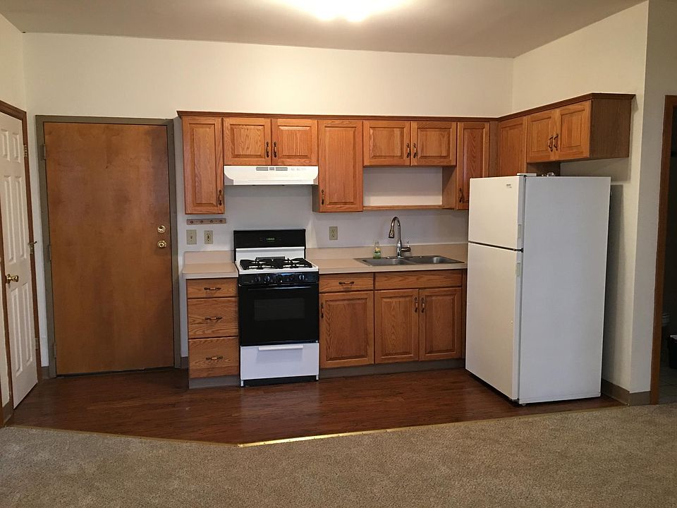 Kitchen with gas range and refrigerator 