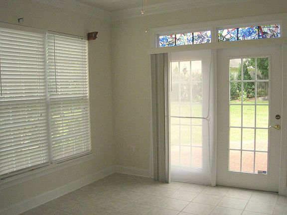 Sunroom with french doors leading to backyard