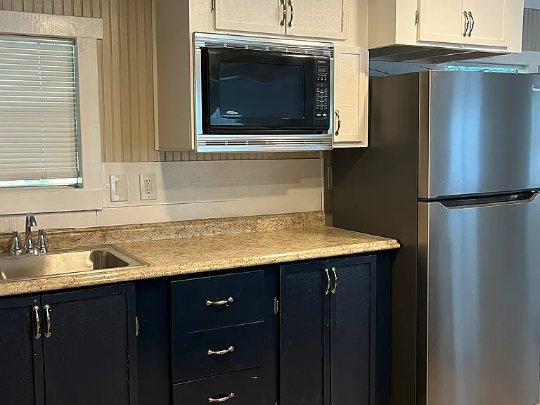 Spacious kitchen with new wall oven. Other appliances included are microwave, refrigerator, four burner cooktop in large island, Plenty of storage.