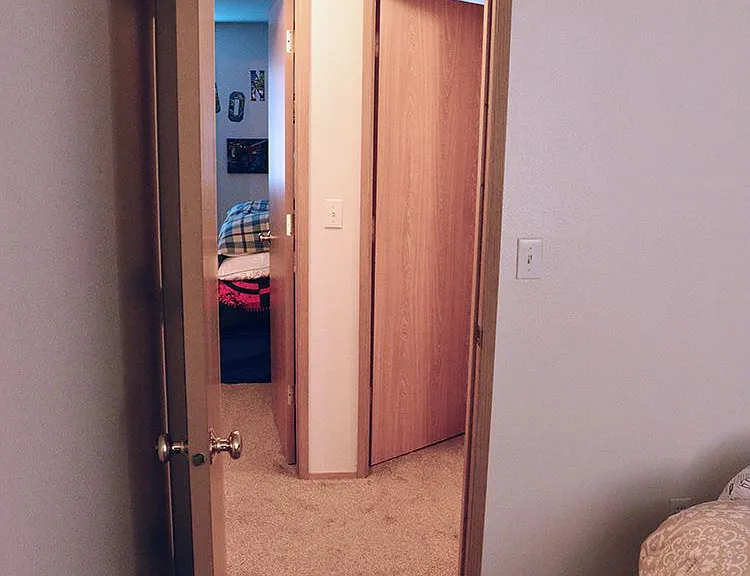 View from master bedroom into hallway showing both bedroom entry way