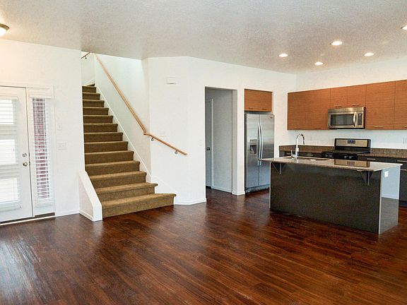 View of Kitchen and Stairs from Family Room
