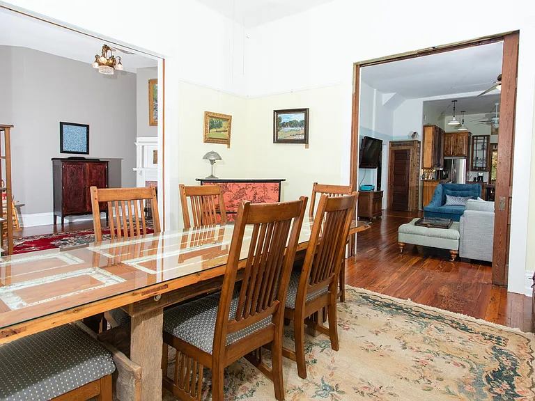 Dining room. Table is one of the house's original nine-foot pocket door and can seat 10.
