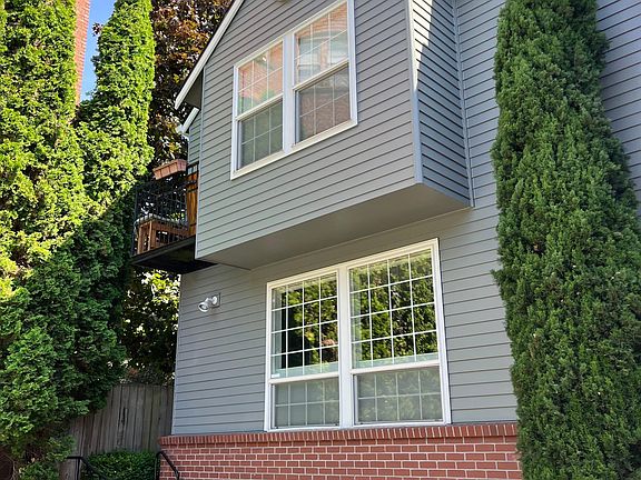 two story townhouse corner unit, set back from street