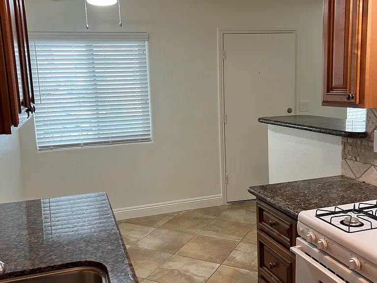 Kitchen from back wall facing dining area
