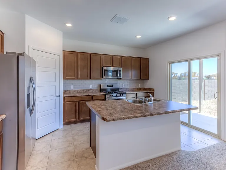 Upgraded Kitchen with Backsplash and SS Appliances