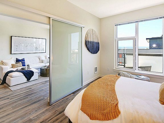 Experience modern comfort in this light-filled apartment with seamless flow between spaces.