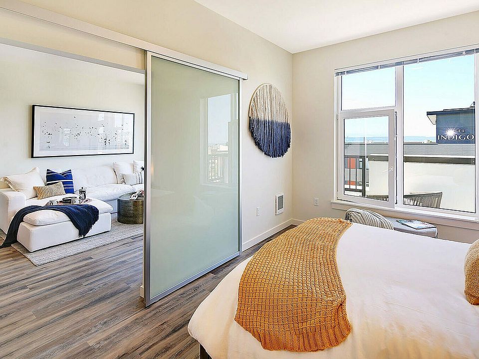 Experience modern comfort in this light-filled apartment with seamless flow between spaces.