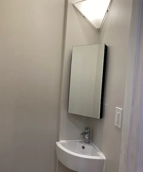 Cute Half bathroom on the 1st floor with corner sink