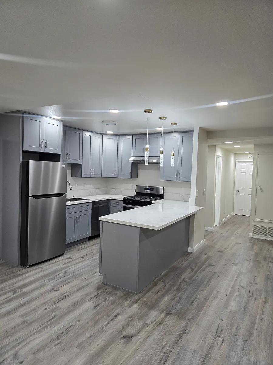 View of the kitchen and hallway from the living room - 592 Palmwood Dr