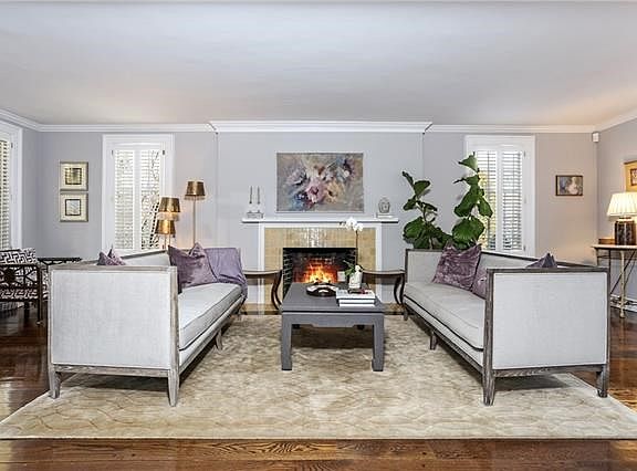 Enchanting Living Room with wood burning fireplace.
