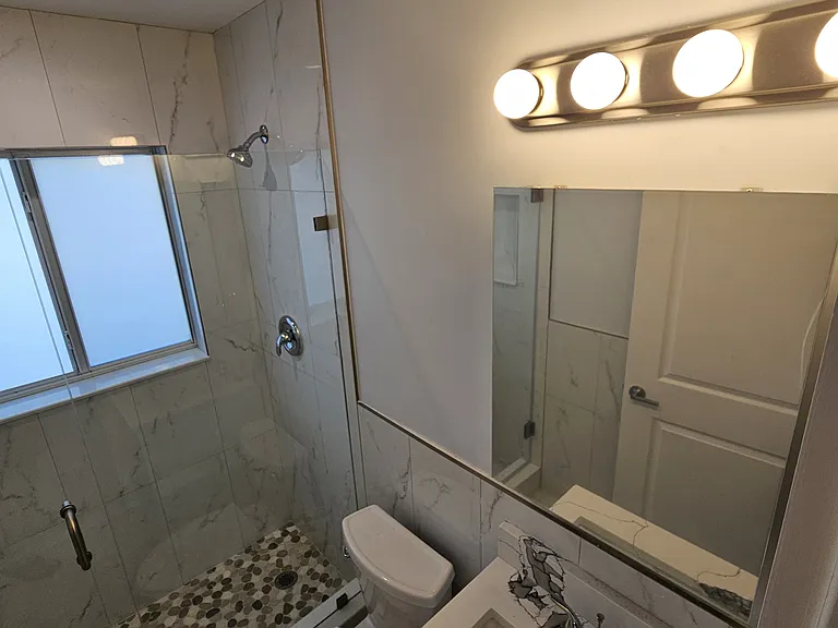 Four vanity lights. Large medicine cabinet lets you put everything away.