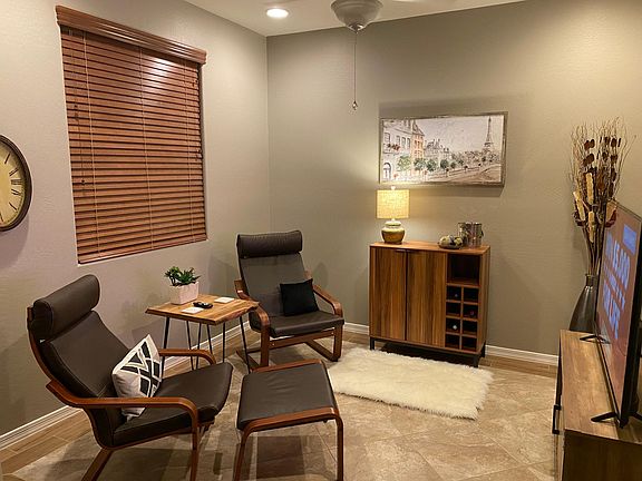 Den with 55" TV and bar