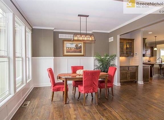 FORMAL DINING WITH WOOD FLOOR AND BUTLER'S PANTRY NEARBY