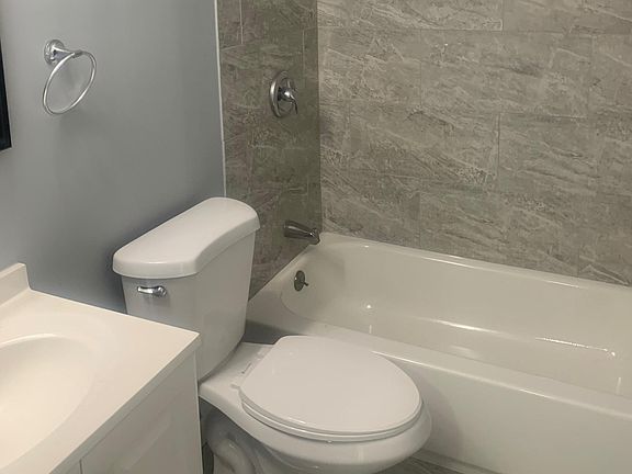 Beautiful Updated Bathroom with Ceramic Tile flooring and walls