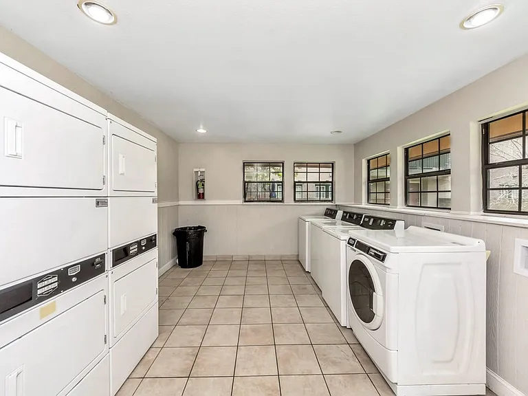 One of three on-site laundry facilities with multiple washers and dryers for resident convenience.
