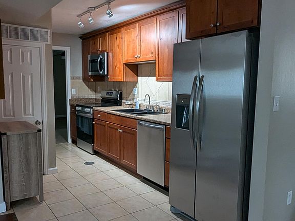 Galley Kitchen with brand new appliances.