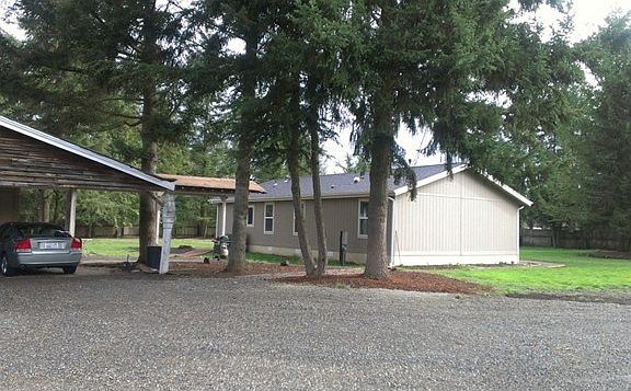 Plenty of parking in idyllic setting of lawns, trees and fields.
