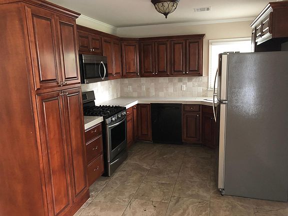 Kitchen with gas cook stove and range, microwave, dishwasher