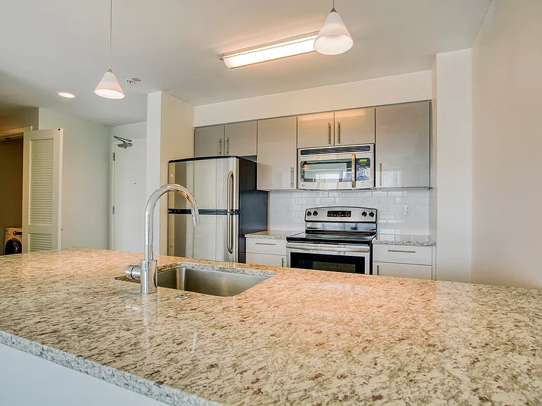 Open concept kitchen with stainless steel appliances