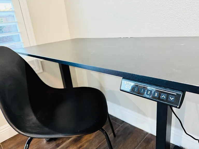 Ajdustable height desk is a must. Change positions and be comfortable.