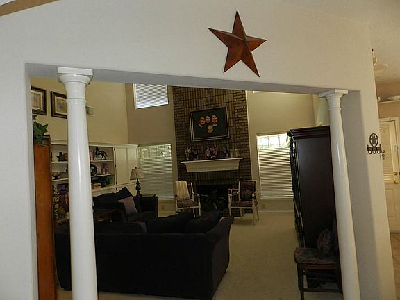 Family room entrance with accent columns.