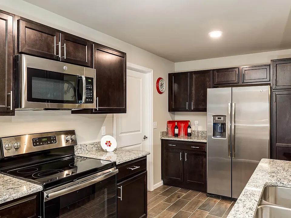 Custom Kitchen with granite, stainless and tile finishes