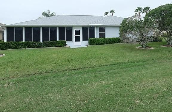View of back yard and back exterior.