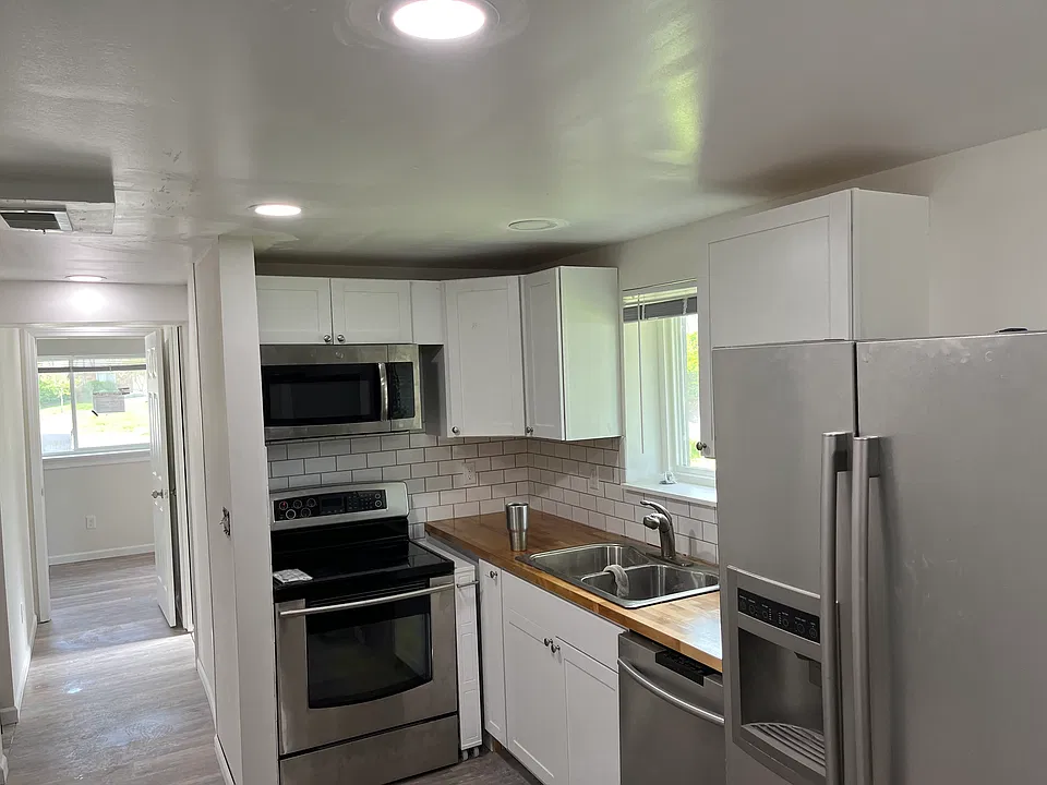 Updated kitchen with stainless steel appliances, real butcher block countertops