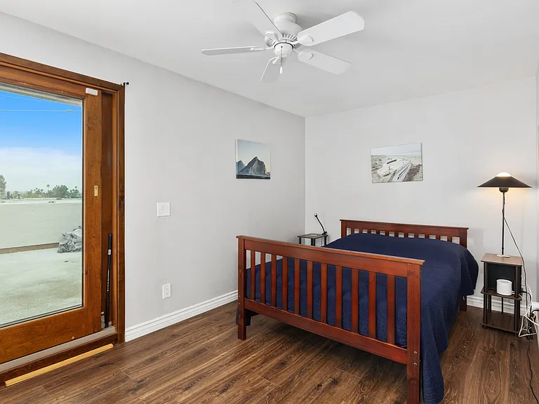 Bedroom with access access to large patio deck with Ocean views